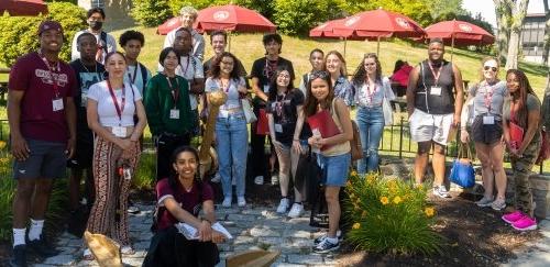 Students gathered together near RIC's anchor statue